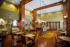 a restaurant with tables and chairs in a room at Hampton Inn & Suites Radcliff/Fort Knox in Radcliff