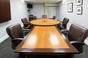 a conference room with a wooden table and chairs at Hampton Inn Elizabethtown in Elizabethtown