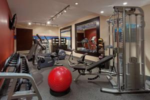 a gym with several tread machines and a red ball at Hampton Inn New Bedford/Fairhaven in Fairhaven