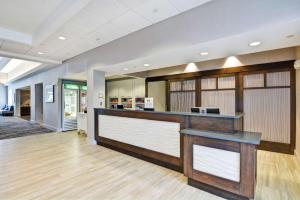 a lobby of a hospital with a reception counter at Homewood Suites Fredericksburg in Fredericksburg