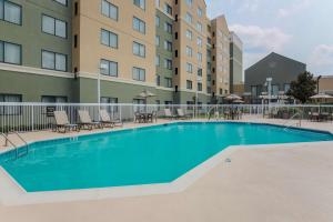 a swimming pool in front of a building at Homewood Suites by Hilton Ft. Worth-North at Fossil Creek in Fort Worth