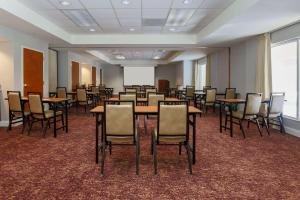 a conference room with tables and chairs and a whiteboard at Homewood Suites by Hilton Ft. Worth-North at Fossil Creek in Fort Worth +31 photos