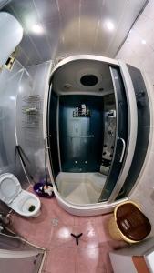 a small bathroom with a toilet in an airplane at Fountain Square Apartment in Baku