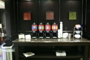 a table with a bunch of bottles on it at Hampton Inn Kilgore in Kilgore