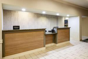 a lobby with a reception desk in a hotel at Homewood Suites by Hilton Gainesville in Gainesville