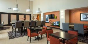 a dining room with a table and chairs at Hampton Inn & Suites Seneca-Clemson Area in Seneca