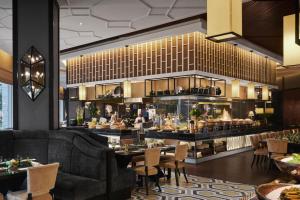 a rendering of a restaurant with tables and chairs at The Majestic Hotel Kuala Lumpur, Autograph Collection - TravelEase Visa-Free Getaway in Kuala Lumpur