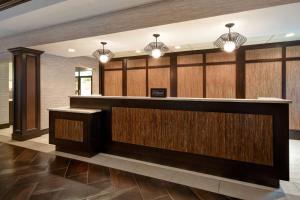 a hotel lobby with a reception counter and lights at Homewood Suites by Hilton Hartford / Southington CT in Southington