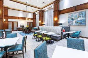 a dining room with tables and chairs at Hampton Inn and Suites Houston Central in Houston