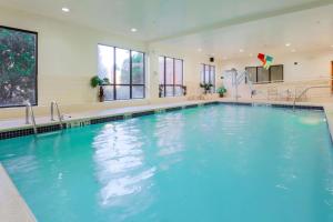 a swimming pool with blue water in a building at Hampton Inn Nanuet in Nanuet