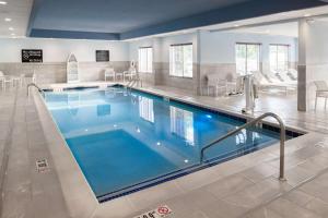 a large swimming pool in a hotel room at Hampton Inn & Suites - Cape Cod / West Yarmouth in West Yarmouth