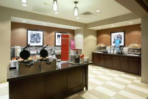 a restaurant with a buffet line with a food counter at Hampton Inn & Suites I-35/Mulvane in Mulvane