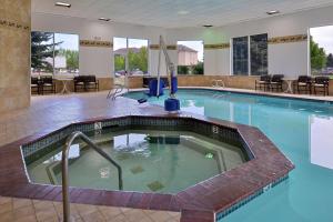 a large swimming pool in the middle of a building at Hampton Inn Idaho Falls / Airport in Idaho Falls