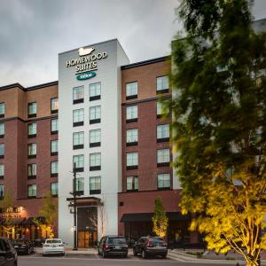 a hotel with cars parked in front of it at Homewood Suites by Hilton Coralville - Iowa River Landing in Coralville