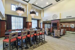 a large dining room with a long table and chairs at Hampton Inn and Suites Indianapolis/Brownsburg in Brownsburg