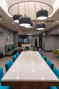 a conference room with a large white table and chairs at Hampton Inn Kinston in Kinston