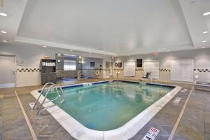 a large swimming pool in a hotel room at The Homewood Suites by Hilton Ithaca in Ithaca
