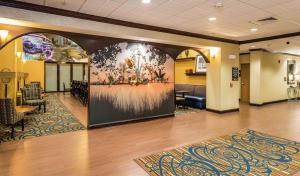 a lobby with a mural of flowers on the wall at Hampton Inn & Suites Jacksonville South - Bartram Park in Jacksonville