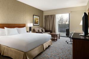 a large white bed in a hotel room at DoubleTree by Hilton Hotel & Executive Meeting Center Somerset in Somerset