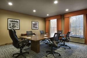 a conference room with a wooden table and chairs at Hampton Inn Greenville/Travelers Rest in Travelers Rest