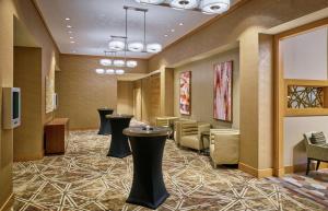 a lobby with stools and a waiting room at DoubleTree by Hilton Houston Intercontinental Airport in Houston