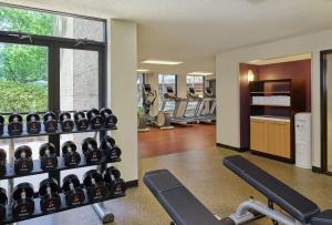 a gym with rows of treadmills and machines at DoubleTree by Hilton Houston Intercontinental Airport in Houston