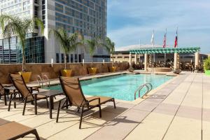 a swimming pool on the roof of a building at Embassy Suites Houston - Downtown in Houston