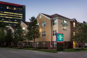 a building with a hamilton shuttle sign in front of it at Homewood Suites by Hilton Houston-Westchase in Houston