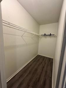 an empty room with a closet with a tennis net at The Avalon in Clearwater