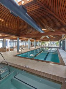 a large swimming pool in a building at DoubleTree by Hilton Hotel Berkeley Marina in Berkeley