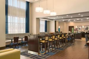 a large dining room with a long table and chairs at Hampton Inn & Suites - Lavonia, GA in Lavonia