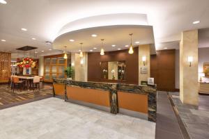 a lobby of a hotel with a reception counter at Homewood Suites by Hilton Houston Downtown in Houston