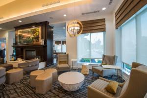 a lobby of a hotel with a fireplace at Homewood Suites by Hilton Trophy Club Fort Worth North in Trophy Club