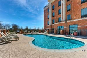 a swimming pool in front of a building at Hampton Inn & Suites - Hartsville, SC in Hartsville