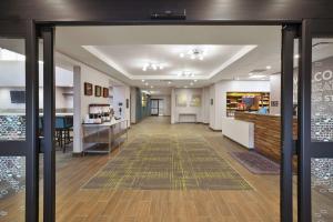 a lobby of a store with the door open at Hampton Inn & Suites Grandville Grand Rapids South in Grandville