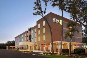 a hotel building with a home depot sign on it at Home2 Suites By Hilton Fernandina Beach on Amelia Island, FL in Fernandina Beach