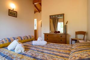 a bedroom with two towels on a bed at Charming House in Águeda with Private Pool in Aguda +32 photos