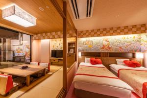 Voodi või voodid majutusasutuse Ryugujo Spa Hotel Mikazuki Fujimitei toas