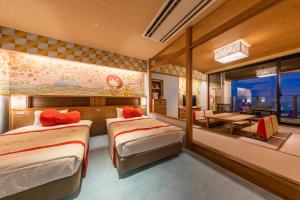 Voodi või voodid majutusasutuse Ryugujo Spa Hotel Mikazuki Fujimitei toas