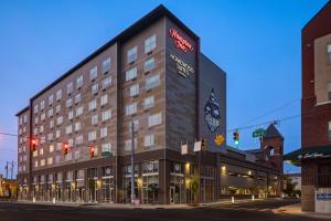 a rendering of a hotel on a street corner at Homewood Suites by Hilton Indianapolis Downtown IUPUI in Indianapolis