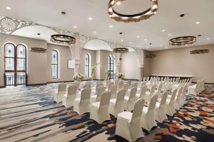a conference room with white chairs and a stage at Homewood Suites by Hilton Indianapolis Downtown IUPUI in Indianapolis +54 photos