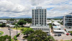 an aerial view of a city with a tall building at Oaks Townsville Metropole Hotel in Townsville