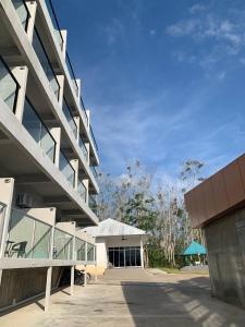 an external view of a building with a blue sky at 365 View Point Resort in Kaki Bukit