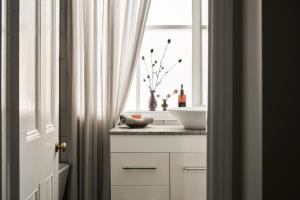 a bathroom with a sink and a window at Luxury Bendigo Stay in Golden Square