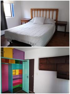 a bedroom with a bed with colorful doors at La Cortesana in Mexico City