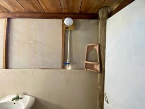 a bathroom with a mirror and a sink at Eco Hostal Estrella De Mar in Isla Mucura
