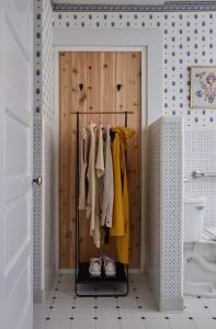 a closet with a wooden door and clothes at Mine and Farm, The Inn at Guerneville, CA in Guerneville