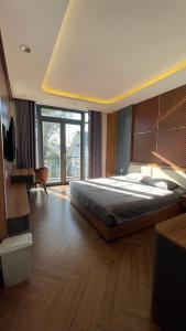 Postel nebo postele na pokoji v ubytování Twin Villa Đà Lạt