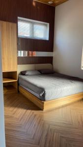 Postel nebo postele na pokoji v ubytování Twin Villa Đà Lạt