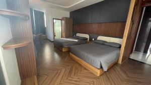 Postel nebo postele na pokoji v ubytování Twin Villa Đà Lạt